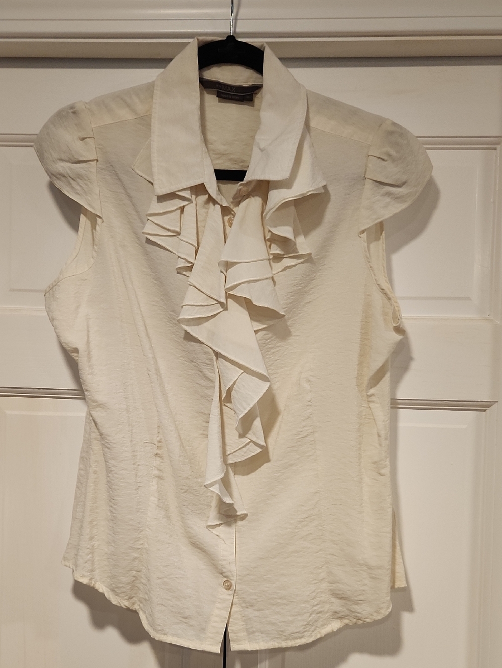 To the Max Cream Ruffle Front Sleeveless Blouse